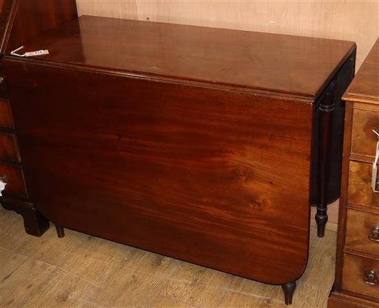 A George III mahogany drop leaf dining table W.160cm extended
